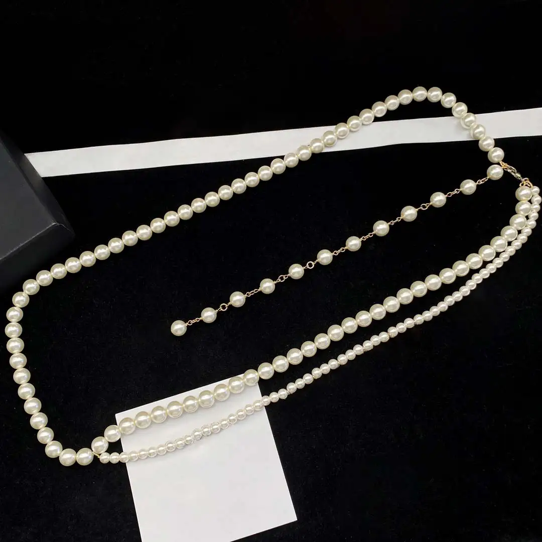 New Charm Vintage Pearl Woman Waist Chain Metal Letter Pendant Strand Long Necklace Luxury Woman Jewelry Wedding Gift
New Charm Vintage Pearl Woman Waist Chain Metal Letter Pendant Strand Long Necklace Luxury Woman Jewelry Wedding Gift