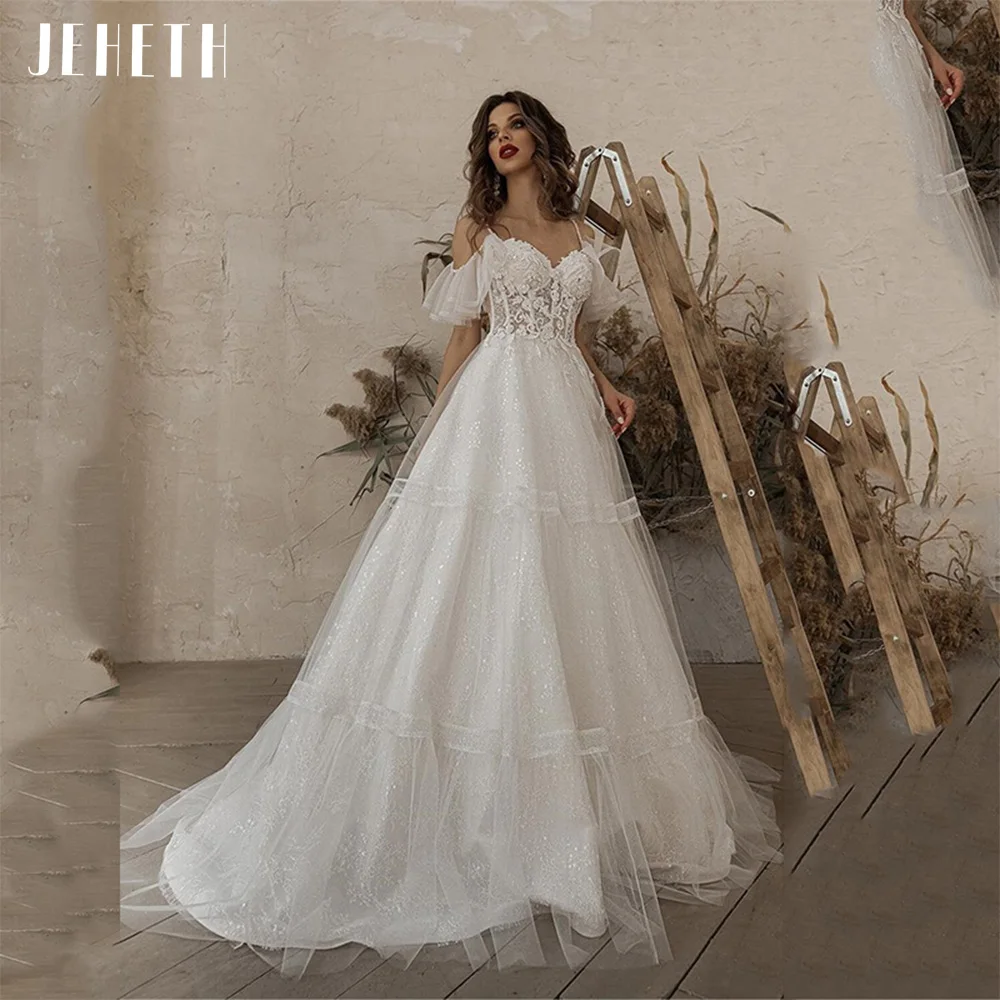 JEHETH Vintage Glitter Tulle Boho Wedding Dress Lace Appliques Spaghetti Straps Off Shoulder BacklessA Line Beach Bridal Gown
JEHETH Vintage Glitter Tulle Boho Wedding Dress Lace Appliques Spaghetti Straps Off Shoulder BacklessA Line Beach Bridal Gown