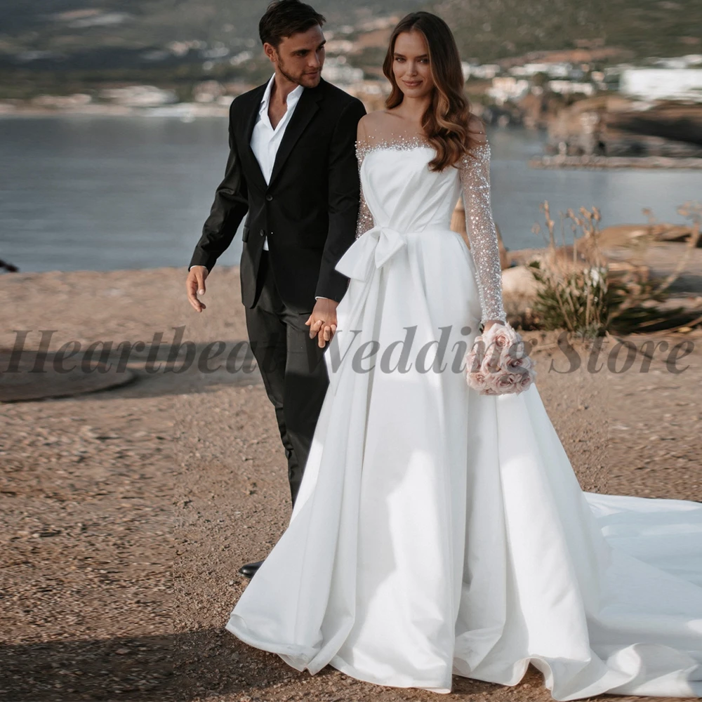Strapless 2023 Elegant Wedding Dress Brides with Button Back Long Sleeve Bow Sequins Beads Court Train A-Line Bridal Gowns
Strapless 2023 Elegant Wedding Dress Brides with Button Back Long Sleeve Bow Sequins Beads Court Train A-Line Bridal Gowns