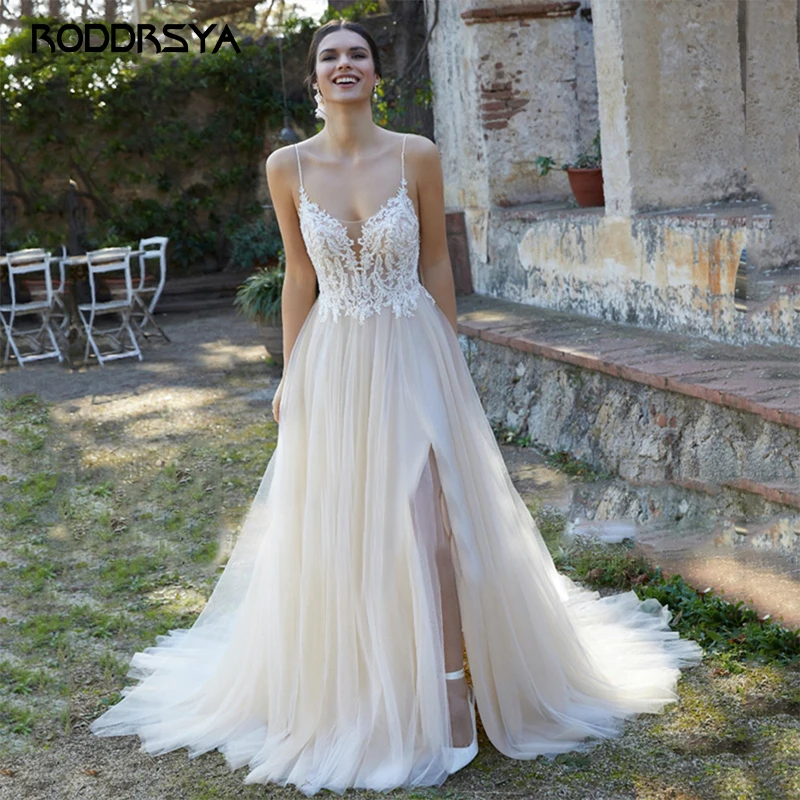 RODDRSYA Beach Spaghetti Straps Wedding Dress Appliques Lace Backless Bridal Party Gown High Slid Tulle Sweep Train Custom Made
RODDRSYA Beach Spaghetti Straps Wedding Dress Appliques Lace Backless Bridal Party Gown High Slid Tulle Sweep Train Custom Made