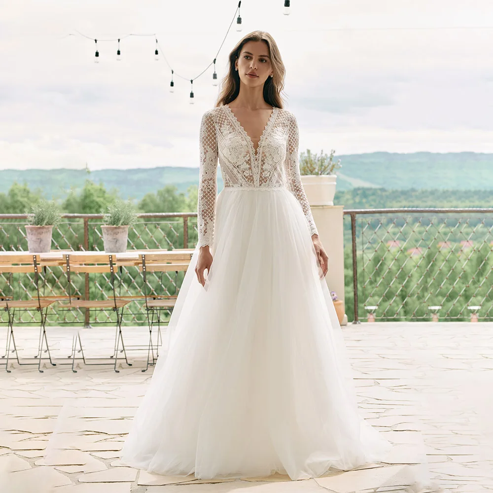Simple Style Lace Appliqué Beaded Tulle Long Sleeve V-Neck Sheer Sexy Design Roddy Dress Factory Custom Vestidos De Novia
Simple Style Lace Appliqué Beaded Tulle Long Sleeve V-Neck Sheer Sexy Design Roddy Dress Factory Custom Vestidos De Novia