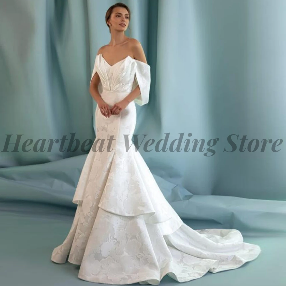 2023 Mermaid Elegant Wedding Dress with V-Neck Detachable Sleeve Backless Court Train Ruffle Applique for Brides Bridal Gowns 
2023 Mermaid Elegant Wedding Dress with V-Neck Detachable Sleeve Backless Court Train Ruffle Applique for Brides Bridal Gowns