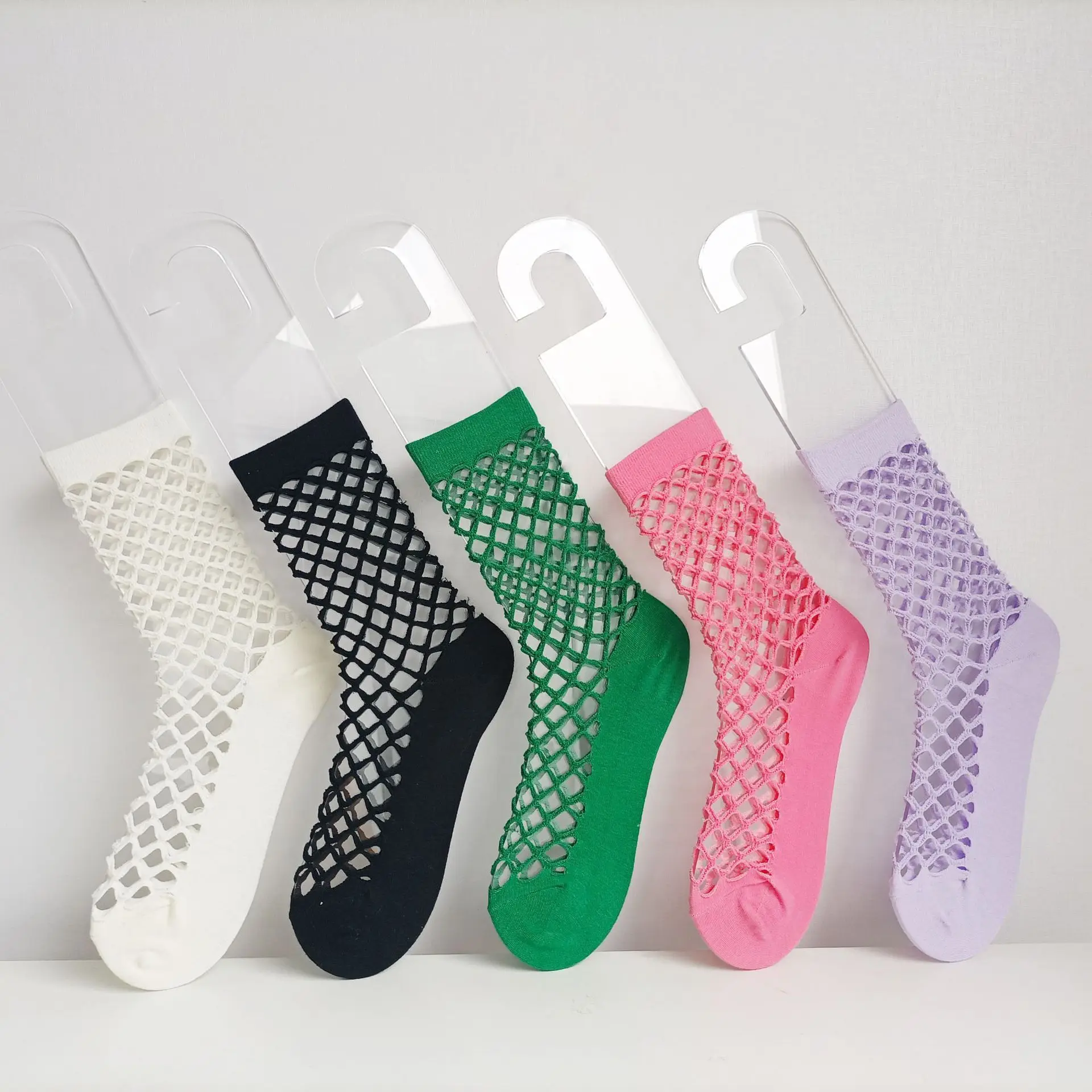 Solid color hole sock women's breathable thin mesh hollow middle tube sock famous design 2022
Solid color hole sock women's breathable thin mesh hollow middle tube sock famous design 2022