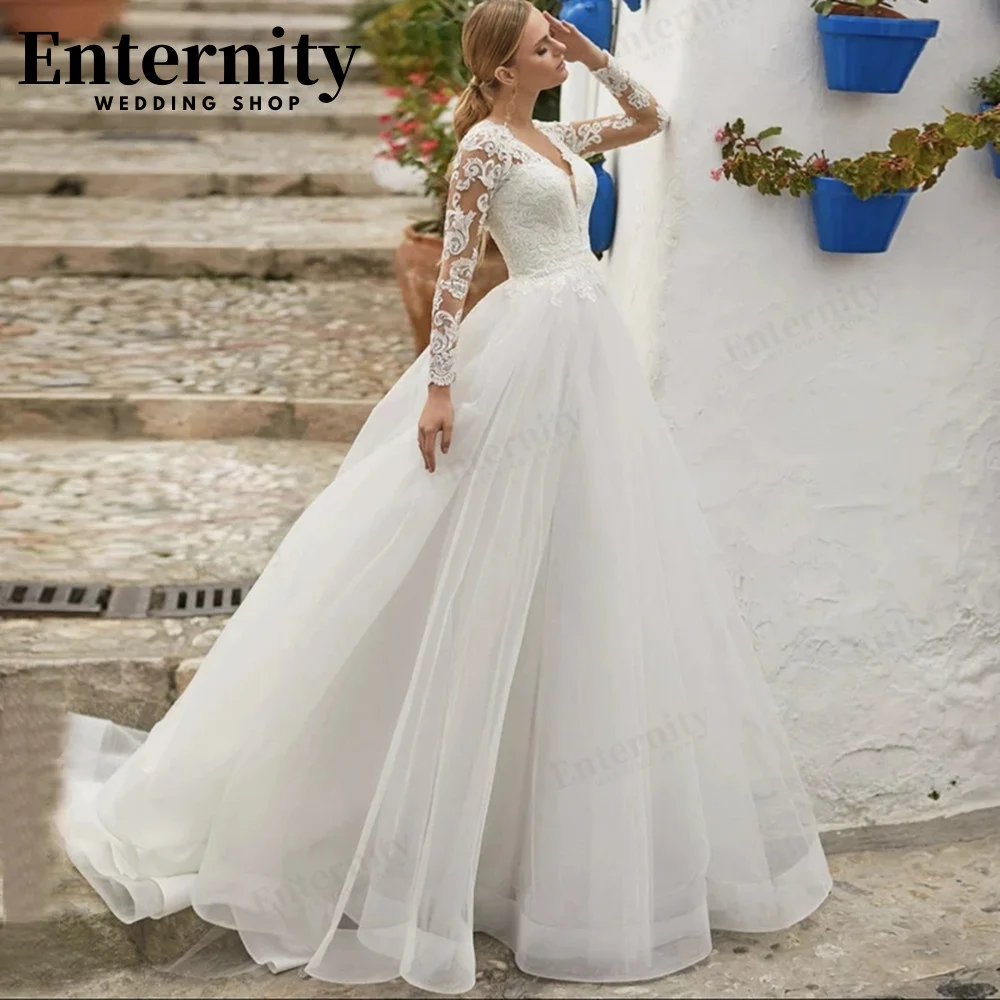 Intriguing V Neck Long Sleeve Bridal Dress A-Line Bride Gown With Button Lace Appliques Backless Sweep Train Robe De Mariée
Intriguing V Neck Long Sleeve Bridal Dress A-Line Bride Gown With Button Lace Appliques Backless Sweep Train Robe De Mariée