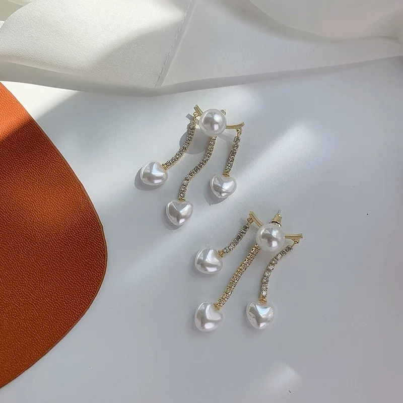 U-Magical Charming Long Tassel Dangle Earring for Women Shining Love Heart Imitation Pearl Rhinestone Metallic Earring Jewelry
U-Magical Charming Long Tassel Dangle Earring for Women Shining Love Heart Imitation Pearl Rhinestone Metallic Earring Jewelry