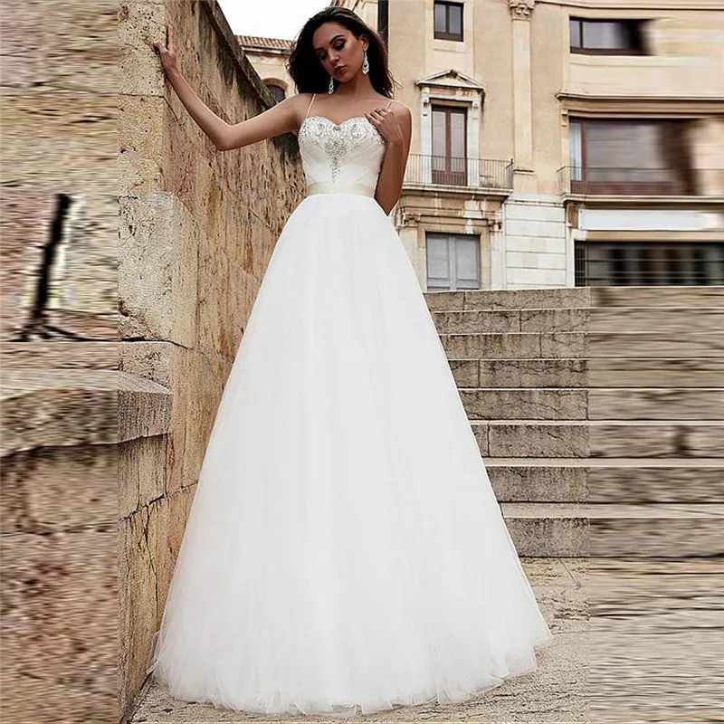 Sexy Spaghetti Strips A-Line Tulle Wedding Dresses Beaded Long Sleeveless Lace Up Back Bridal Gowns 2020 Custom Simple Fashion
Sexy Spaghetti Strips A-Line Tulle Wedding Dresses Beaded Long Sleeveless Lace Up Back Bridal Gowns 2020 Custom Simple Fashion