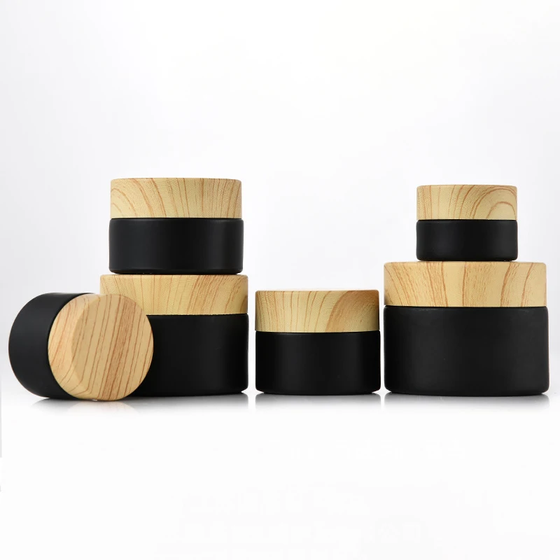 Wholesale 5G-50G Glass Empty Jars Mini Pots Matte Black Cosmetic Face Cream Lip Balm Containers Wood Refillable Bottles
Wholesale 5G-50G Glass Empty Jars Mini Pots Matte Black Cosmetic Face Cream Lip Balm Containers Wood Refillable Bottles