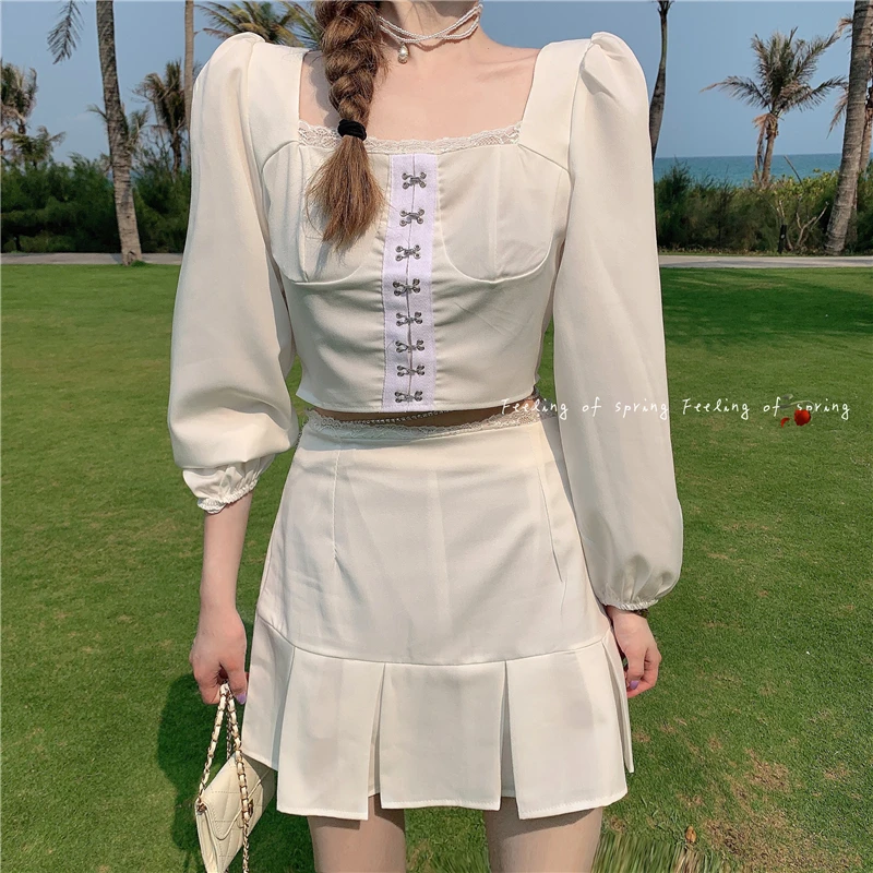 2021 summer Fashion sweet women 2 Piece Sets Long Sleeve Square neck design top + fishtail pleated skirt suit 
2021 summer Fashion sweet women 2 Piece Sets Long Sleeve Square neck design top + fishtail pleated skirt suit