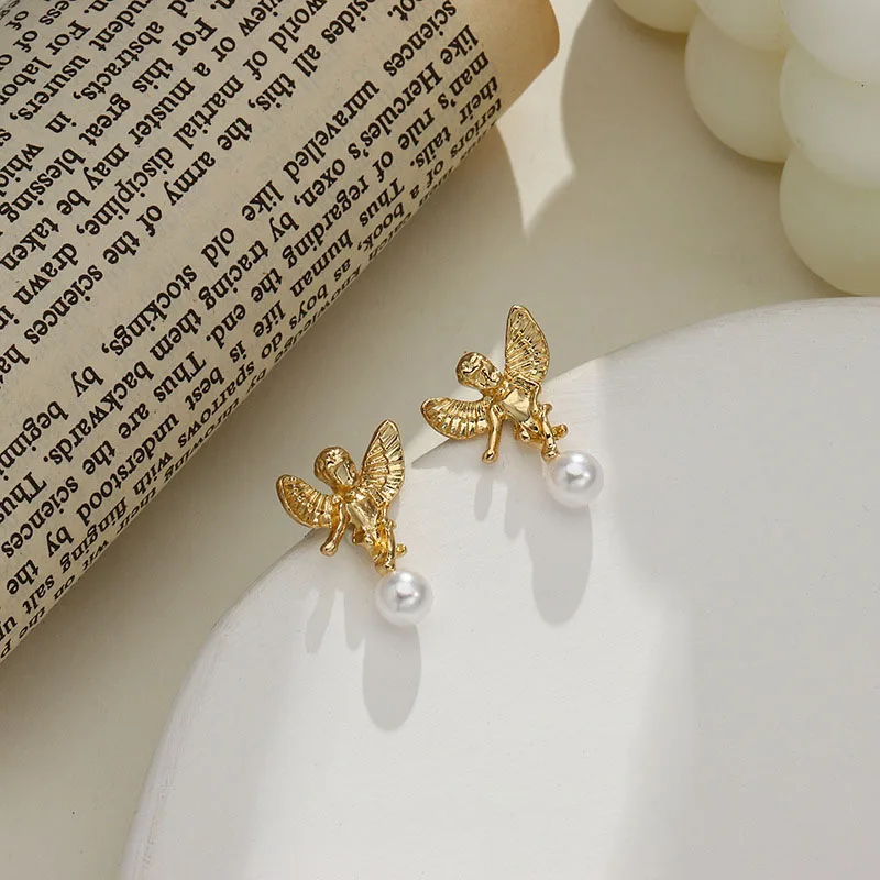 Unique Design Gold Color Alloy Cartoon Angel Pendant Earrings for Women Ladies Simulation Pearl Earrings Trendy Accessories 
Unique Design Gold Color Alloy Cartoon Angel Pendant Earrings for Women Ladies Simulation Pearl Earrings Trendy Accessories