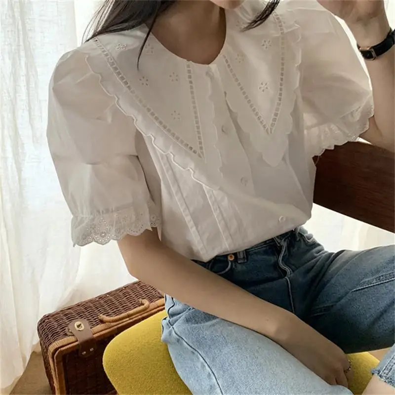 Women's summer retro peter pan collar hollow out flower contrast color loose single breasted puff sleeve vintage T-shirt
Women's summer retro peter pan collar hollow out flower contrast color loose single breasted puff sleeve vintage T-shirt