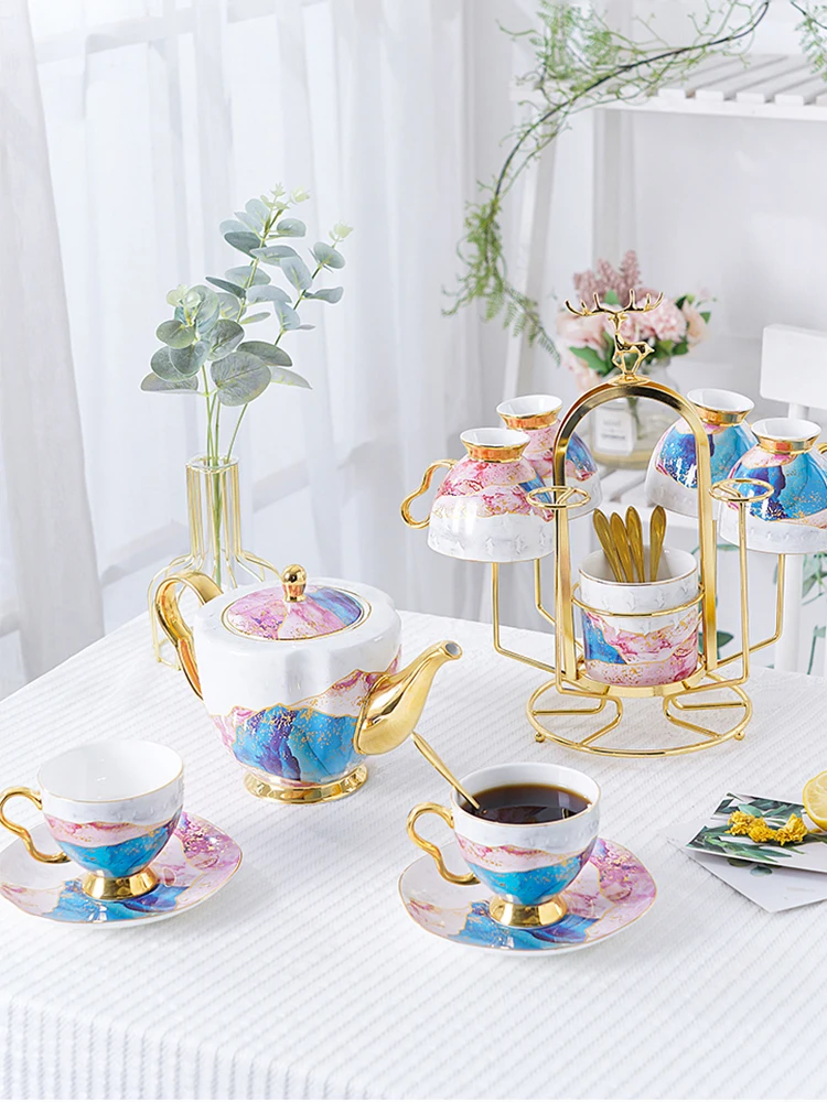European 6 Pieces Royal Bone China Tea Set British Luxury Drinkware 900ml Teapot Ceramic Coffee Cups Tray Holder Combination
European 6 Pieces Royal Bone China Tea Set British Luxury Drinkware 900ml Teapot Ceramic Coffee Cups Tray Holder Combination