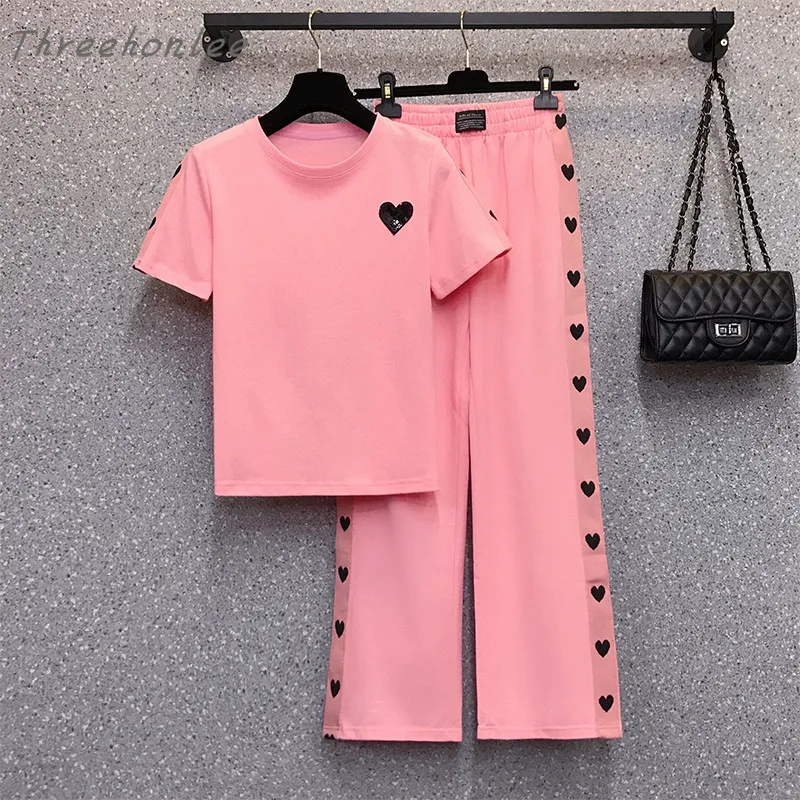 2021 Summer New Casual Women Two Piece Sets O-neck Short Sleeve Sequined T-shirt And Side Heart-shaped Wide Leg Pants Suits
2021 Summer New Casual Women Two Piece Sets O-neck Short Sleeve Sequined T-shirt And Side Heart-shaped Wide Leg Pants Suits
