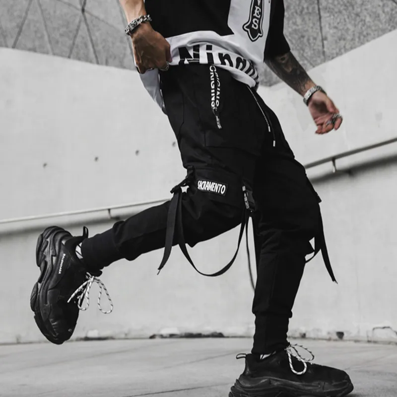 2020 New Hip Hop Joggers Men Black Harem Cargo Pants Multi-pocket Ribbons Man Sweatpants Streetwear Casual Mens Pants 3XL
2020 New Hip Hop Joggers Men Black Harem Cargo Pants Multi-pocket Ribbons Man Sweatpants Streetwear Casual Mens Pants 3XL