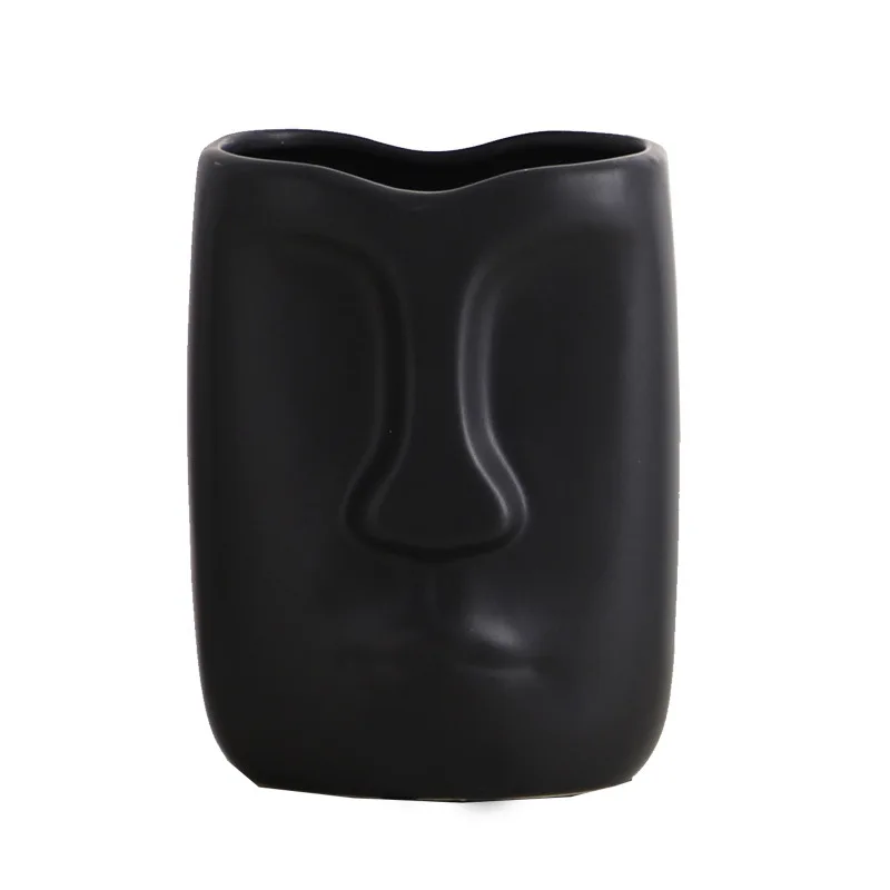 Nordic Minimalist Ceramic Abstract Vase Black And White Human Face Creative Display Room Decorative Figue Head Shape Vase 
Nordic Minimalist Ceramic Abstract Vase Black And White Human Face Creative Display Room Decorative Figue Head Shape Vase