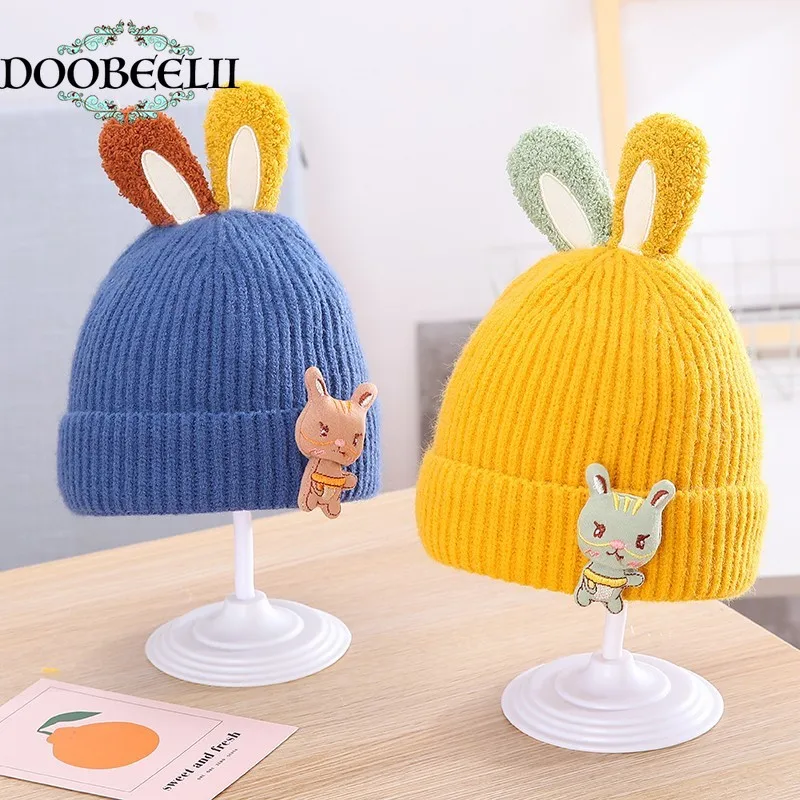 Детская шерстяная шапка с ушами на осень и зиму, утепленная теплая вязаная шапка с рукавами, шапка с мультяшным кроликом для мужчин и женщин 
Детская шерстяная шапка с ушами на осень и зиму, утепленная теплая вязаная шапка с рукавами, шапка с мультяшным кроликом для мужчин и женщин