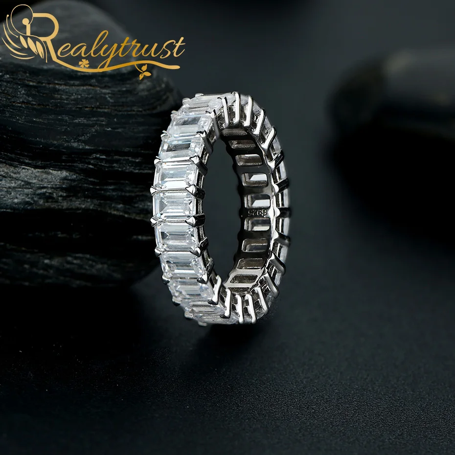 Realytrust Sparkling Emerald Cut Lab Created Diamond Eternity Band Promise Ring 925 Sterling Silver Wedding Ring for Women Man 
Realytrust Sparkling Emerald Cut Lab Created Diamond Eternity Band Promise Ring 925 Sterling Silver Wedding Ring for Women Man
