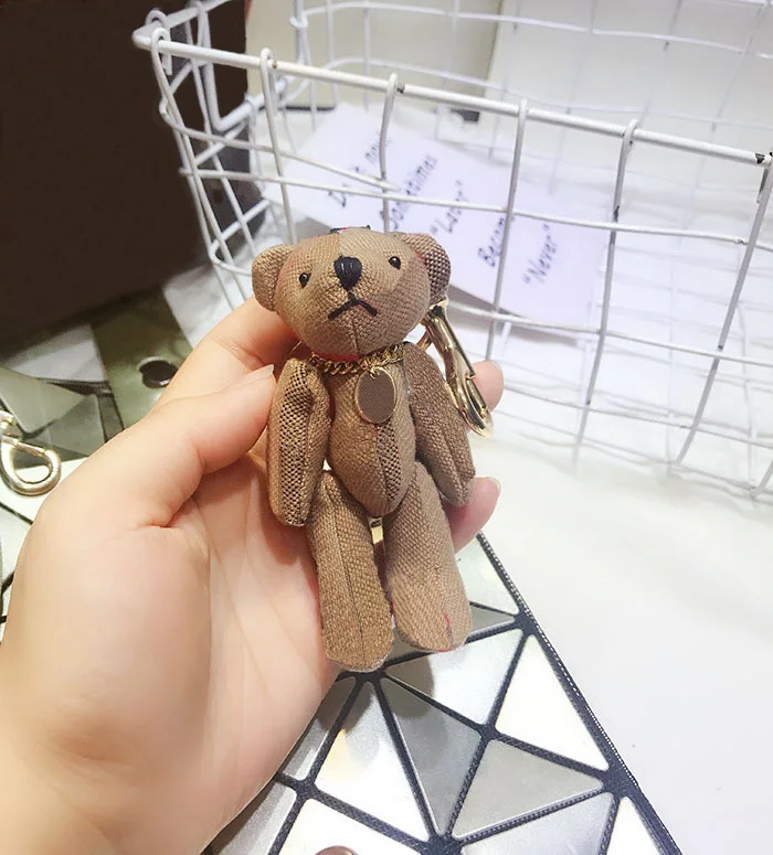 European and American Popular Brand Luxury Cartoon Cloth Bear Keychain Fashion Korean Bag Decoration Pendant Keyring Couple Gift
European and American Popular Brand Luxury Cartoon Cloth Bear Keychain Fashion Korean Bag Decoration Pendant Keyring Couple Gift