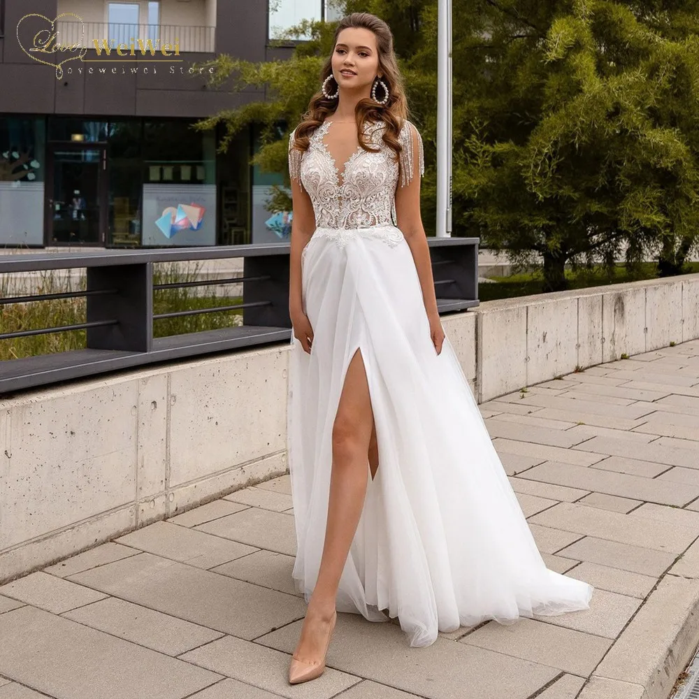 Sheer V-Neck Wedding Dresses For Bride A-Line Sleeveless Floor Length Backless Tassel Lace Applique Beading Vestidos De Novia
Sheer V-Neck Wedding Dresses For Bride A-Line Sleeveless Floor Length Backless Tassel Lace Applique Beading Vestidos De Novia