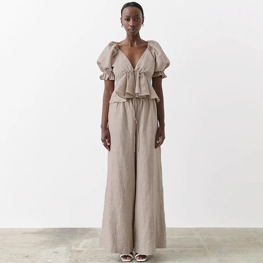 Cotton Linen Leaking Back V-neck Puff Sleeve Short-sleeved Shirt Women's Wide Leg Pants Were Thin Trousers Two Piece Suit
Cotton Linen Leaking Back V-neck Puff Sleeve Short-sleeved Shirt Women's Wide Leg Pants Were Thin Trousers Two Piece Suit