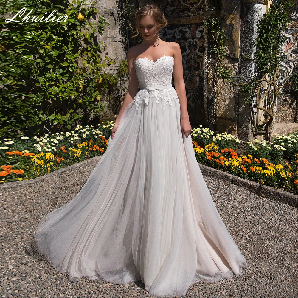 Lhuilier Elegant A Line Strapless Beach Tulle Wedding Dresses Sleeveless Floor Length Lace Bridal Gowns Court Train with Belt
Lhuilier Elegant A Line Strapless Beach Tulle Wedding Dresses Sleeveless Floor Length Lace Bridal Gowns Court Train with Belt