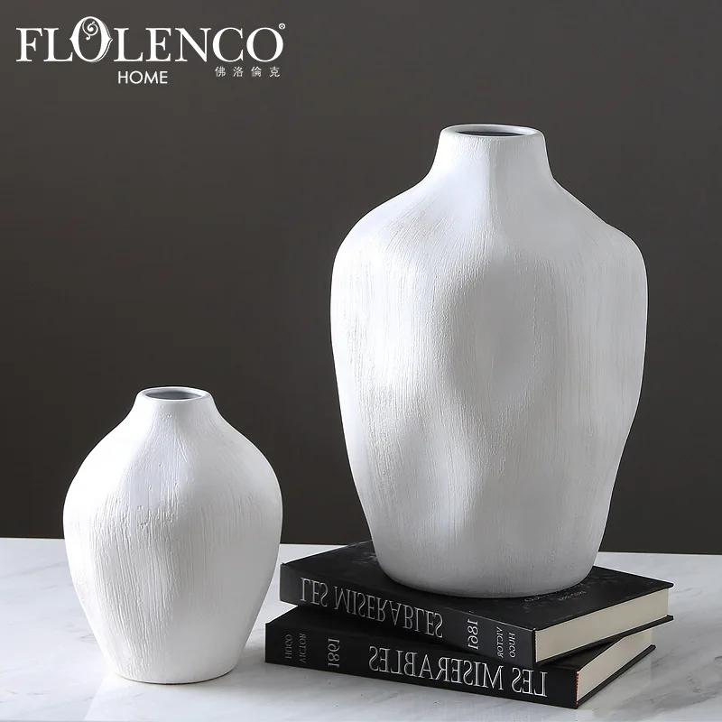 Nordic minimalist white ceramic round concave vase fashion modern living room model room home soft decoration handicraft
Nordic minimalist white ceramic round concave vase fashion modern living room model room home soft decoration handicraft