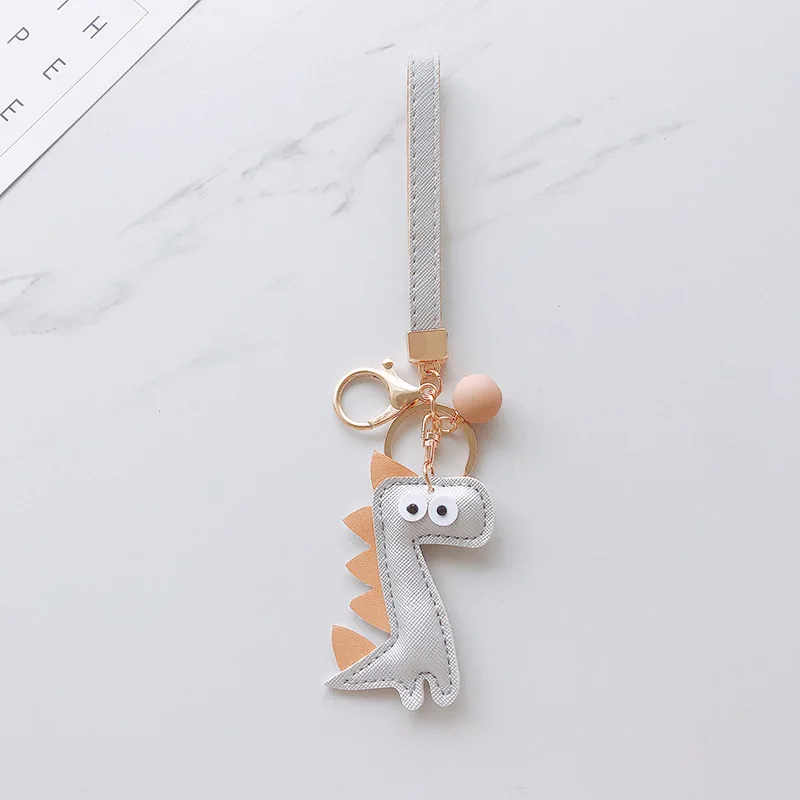 Interesting Small Dinosaur Keychain Cute Creative Silicone Couples Backpack Handbag Car Key Pendant Accessories Hot Sale Gift
Interesting Small Dinosaur Keychain Cute Creative Silicone Couples Backpack Handbag Car Key Pendant Accessories Hot Sale Gift