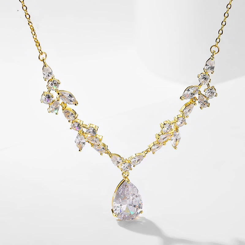 IHUES Trendy Water Drop Cubic Zirconia Pendant Necklaces Gold & Silver Color Choker Necklace for Women Fashion Bridal Jewelry
IHUES Trendy Water Drop Cubic Zirconia Pendant Necklaces Gold & Silver Color Choker Necklace for Women Fashion Bridal Jewelry