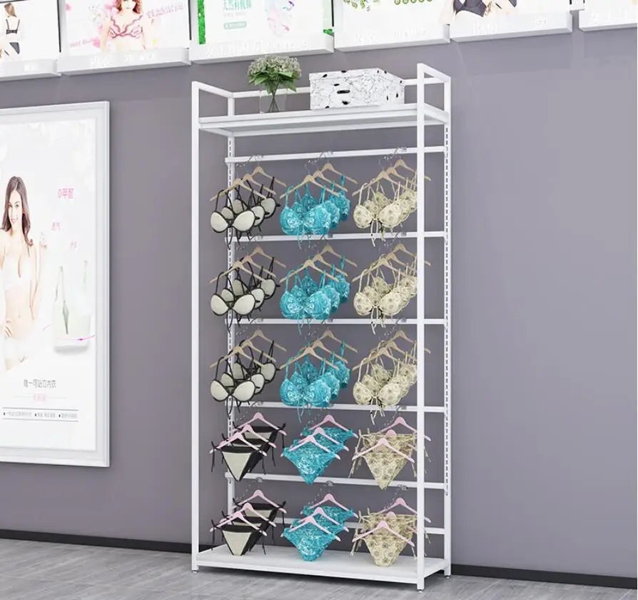 Underwear store display stand against the wall bra is hanging on the floor clothing underpants display shelf gold
Underwear store display stand against the wall bra is hanging on the floor clothing underpants display shelf gold