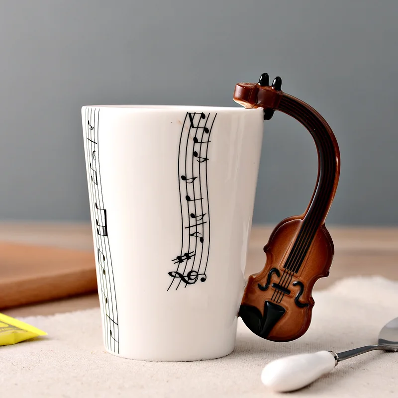 Novelty 250ml Ceramic Cup Piano Violin Guitar Mug Personality Music Note Milk Juice Lemon Mug Coffee Tea Cup with Handle Gift
Novelty 250ml Ceramic Cup Piano Violin Guitar Mug Personality Music Note Milk Juice Lemon Mug Coffee Tea Cup with Handle Gift