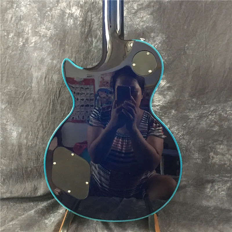 Factory direct custom guitar electric guitar, maple flame top, blue big flower guitar, silver accessories,
Factory direct custom guitar electric guitar, maple flame top, blue big flower guitar, silver accessories,