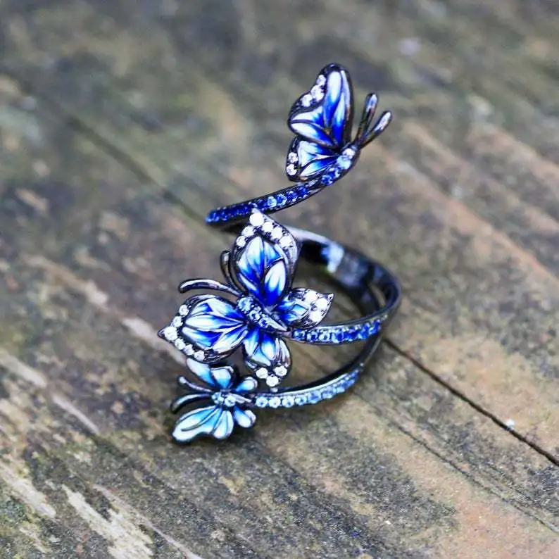 Female Vintage Jewelry Blue Butterfly Black Gold Color Rings for Women Elegant Handmade Enamel Shiny Zircon Wedding Party Rings
Female Vintage Jewelry Blue Butterfly Black Gold Color Rings for Women Elegant Handmade Enamel Shiny Zircon Wedding Party Rings