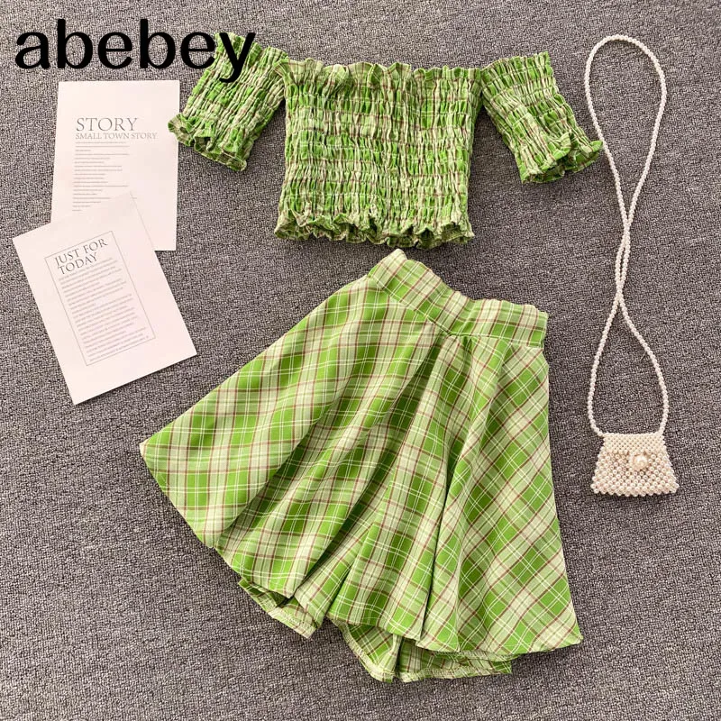 Женский летний комплект в клетку, короткий топ с открытыми плечами и вырезом-лодочкой и юбка-трапеция мини с высокой талией в стиле бохо, ком...
Женский летний комплект в клетку, короткий топ с открытыми плечами и вырезом-лодочкой и юбка-трапеция мини с высокой талией в стиле бохо, ком...