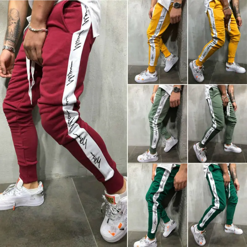Casual Men's Sport Pants Long Trousers Slim Side Stripe Letter Tracksuit Fitness Workout Joggers Gym Harem Sweatpants 
Casual Men's Sport Pants Long Trousers Slim Side Stripe Letter Tracksuit Fitness Workout Joggers Gym Harem Sweatpants