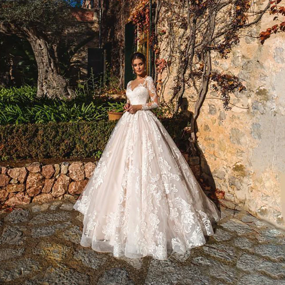 Elegant Princess Wedding Dresses A-Line Robe De Mariée Sexy V-neck Lace Appliques Long Sleeves Button Bridal Gowns 2021
Elegant Princess Wedding Dresses A-Line Robe De Mariée Sexy V-neck Lace Appliques Long Sleeves Button Bridal Gowns 2021