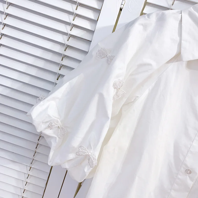 Lapel Bow Bead Stitching Bubble Top Solid Color Short Sleeve Shirt 2021 Summer Single Breasted Loose Casual Blouses Women
Lapel Bow Bead Stitching Bubble Top Solid Color Short Sleeve Shirt 2021 Summer Single Breasted Loose Casual Blouses Women