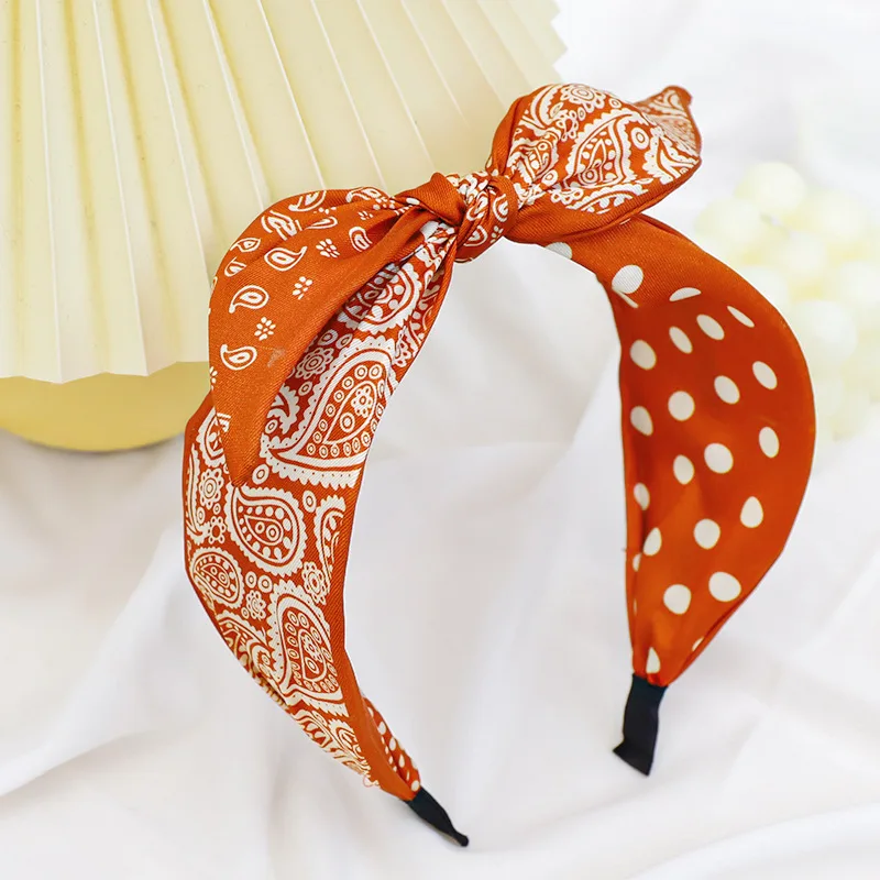 Fashion new product headband Korean version of printed fabric wide brim hair accessories headband ladies headband bow hairband
Fashion new product headband Korean version of printed fabric wide brim hair accessories headband ladies headband bow hairband