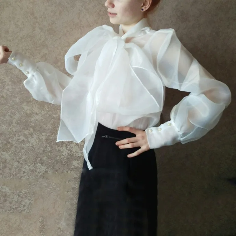 Women's Blouse White Loose Organza Shirt 2021 Luxury Bow Tie Lace Long Puff Sleeve Sheer Shirts Elegant Clothing Female Vintage
Women's Blouse White Loose Organza Shirt 2021 Luxury Bow Tie Lace Long Puff Sleeve Sheer Shirts Elegant Clothing Female Vintage
