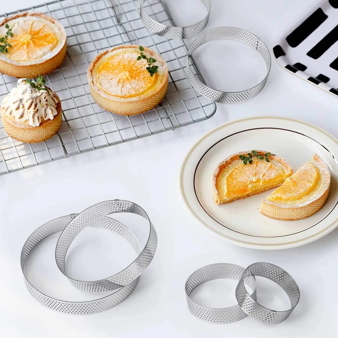 Heat-resistant porous egg ring ring bottom tower round stainless steel cake mold baking tool porous cake mousse ring home tool
Heat-resistant porous egg ring ring bottom tower round stainless steel cake mold baking tool porous cake mousse ring home tool