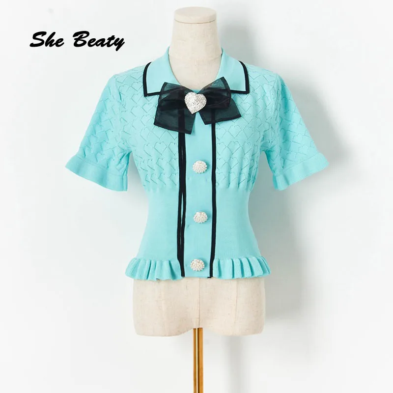 She Beaty Knitted Sweater Pullovers Women Korean Fashion Harajuku Ruched Bow Button Up Short Sleeve Clothes Elegant Kawaii Tops
She Beaty Knitted Sweater Pullovers Women Korean Fashion Harajuku Ruched Bow Button Up Short Sleeve Clothes Elegant Kawaii Tops