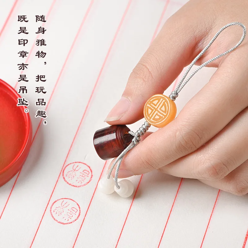 Small leaf red sandalwood Chinese elements round seal couple pendant pendant unisex gift text series warning world motto seal
Small leaf red sandalwood Chinese elements round seal couple pendant pendant unisex gift text series warning world motto seal