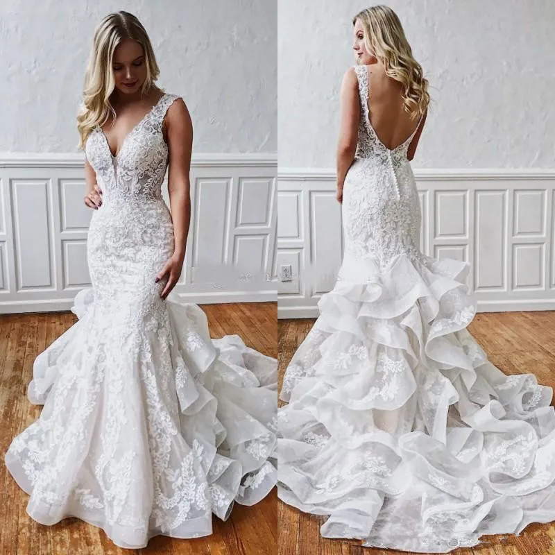 Sexy Mermaid Lace Backless Wedding Dresses 2020 Deep V Neck Beach Bridal Gowns Ruffled Skirt Plus Size Bohemian Trumpet Vestidos
Sexy Mermaid Lace Backless Wedding Dresses 2020 Deep V Neck Beach Bridal Gowns Ruffled Skirt Plus Size Bohemian Trumpet Vestidos