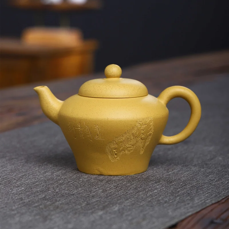Yixing raw ore block mud carved purple clay pot manual Chinese teapot Kung Fu Tea Set 
Yixing raw ore block mud carved purple clay pot manual Chinese teapot Kung Fu Tea Set