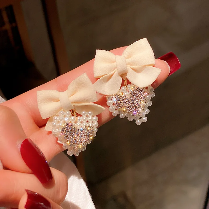 Korean Fashion Cute Earrings Imitation Pearl Love Flannel Bow Earrings Fashion Creative Earrings Women Wholesale
Korean Fashion Cute Earrings Imitation Pearl Love Flannel Bow Earrings Fashion Creative Earrings Women Wholesale