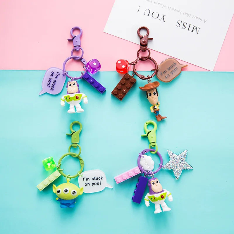 

Disney Toy Story Buzz Lightyear Key Chain Woody Three-Eyed Strawberry Bear Keychain Car Pendant Lady Gift Keyring