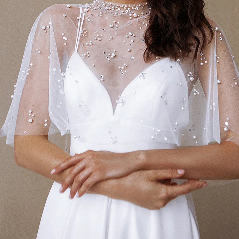 Fashion Sweep Strain Wedding Dresses Pearl Beading White Cape Spaghetti Straps Bridal Gown Elegant V Neck Sleeveless
Fashion Sweep Strain Wedding Dresses Pearl Beading White Cape Spaghetti Straps Bridal Gown Elegant V Neck Sleeveless