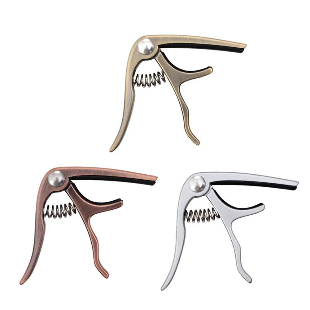 1pcs Acoustic Guitar Capo Quick Change Tune Trigger Clamp Trigger Bass Violin Ukulele Capo Single-handed Tune Adjuster 
1pcs Acoustic Guitar Capo Quick Change Tune Trigger Clamp Trigger Bass Violin Ukulele Capo Single-handed Tune Adjuster