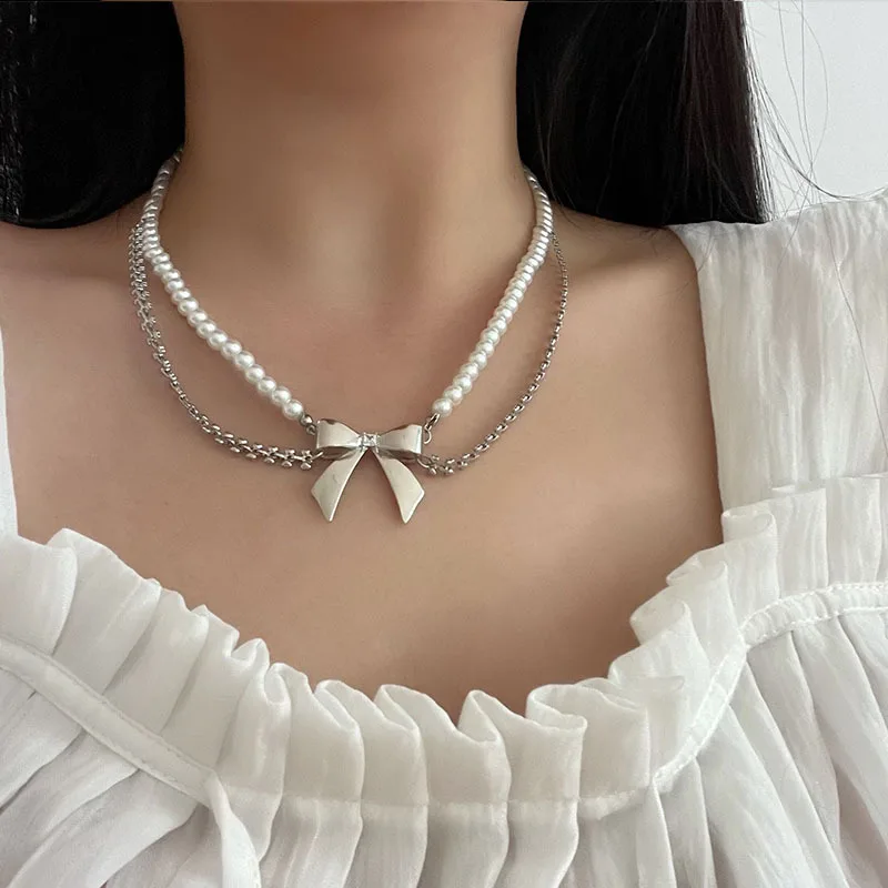 Temperament metal bow pearl necklace double layer chain versatile clavicle chain neck chain female
Temperament metal bow pearl necklace double layer chain versatile clavicle chain neck chain female