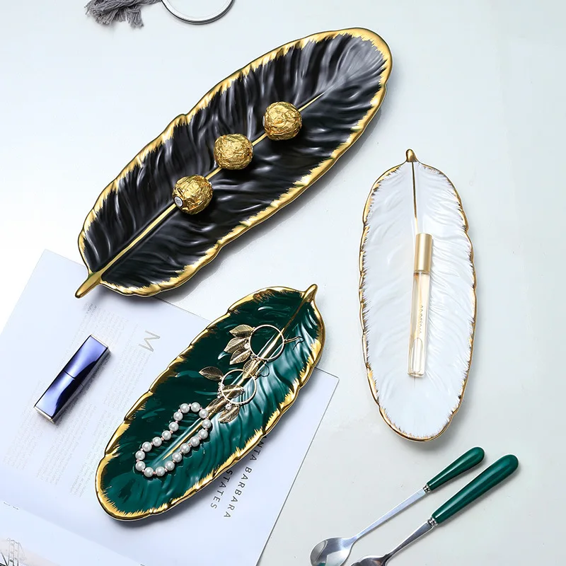 Nordic Luxury Phnom Penh Ceramic Dessert PlateWear-resistant Feather Shape Food Plate for Home Banana Leaf Fruit Plate Storage
Nordic Luxury Phnom Penh Ceramic Dessert PlateWear-resistant Feather Shape Food Plate for Home Banana Leaf Fruit Plate Storage