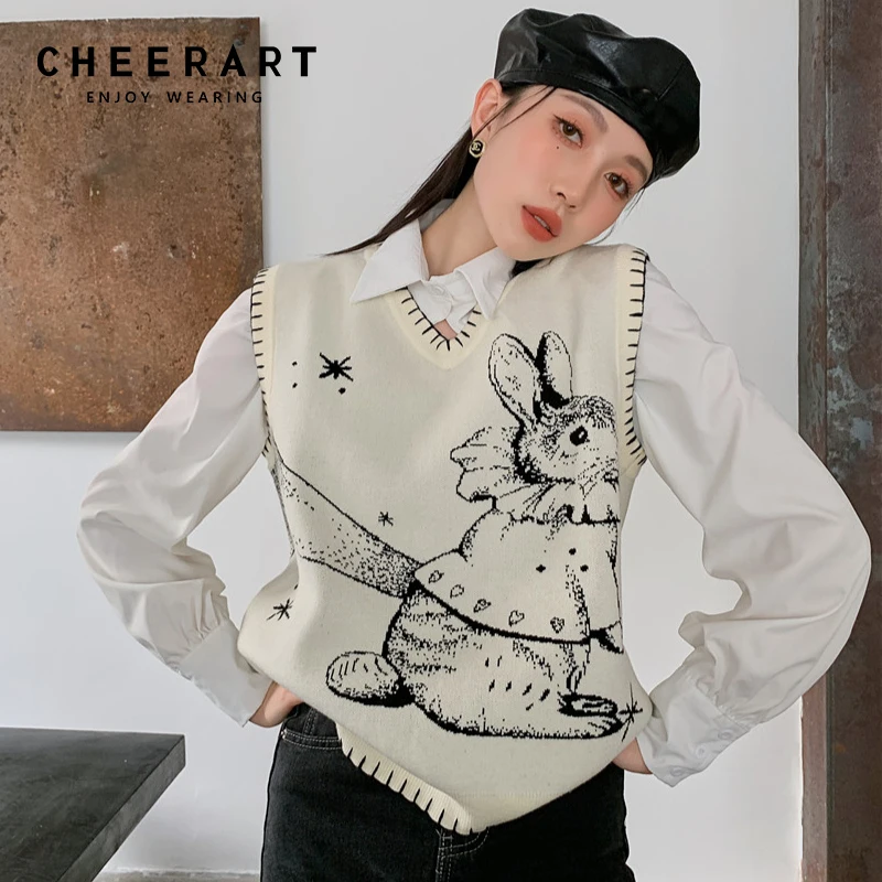 CHEERART белый кавайный свитер, жилет для женщин, модный свитер без рукавов с V-образным вырезом и принтом кролика, модный вязаный Топ в Корейско...
CHEERART белый кавайный свитер, жилет для женщин, модный свитер без рукавов с V-образным вырезом и принтом кролика, модный вязаный Топ в Корейско...
