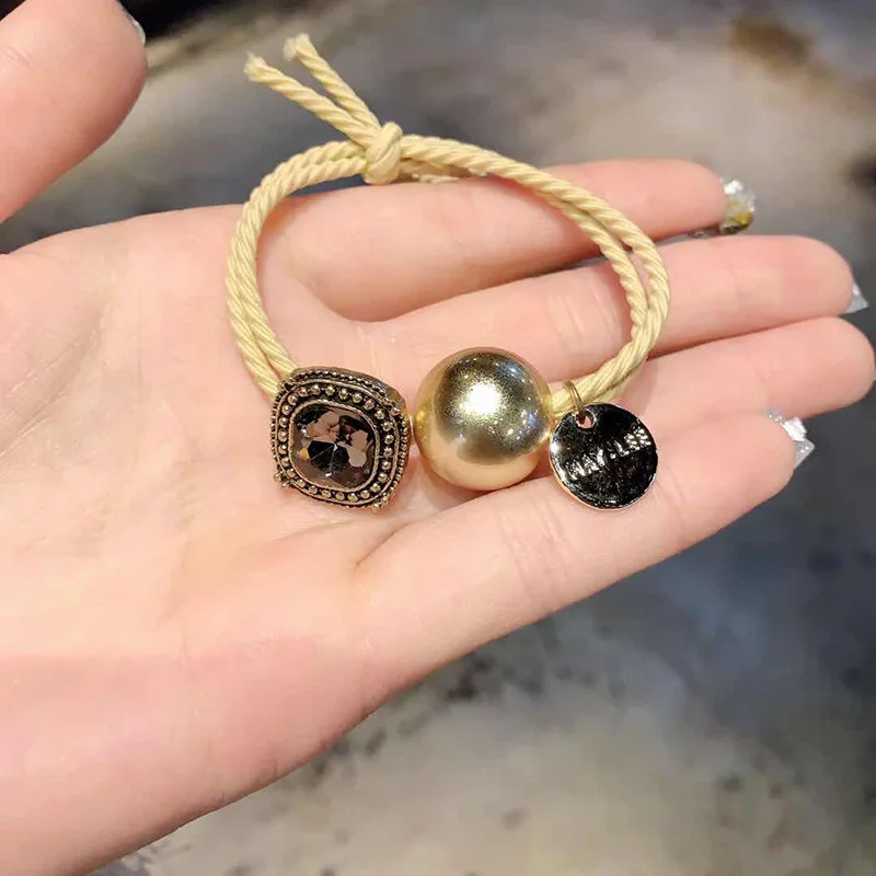 100pcs / lot Crystal Gold Beads elegant style headband Korean women's hair rope high elastic adult band Hairband 
100pcs / lot Crystal Gold Beads elegant style headband Korean women's hair rope high elastic adult band Hairband